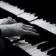 A beginner pianist plays piano, black and white photo